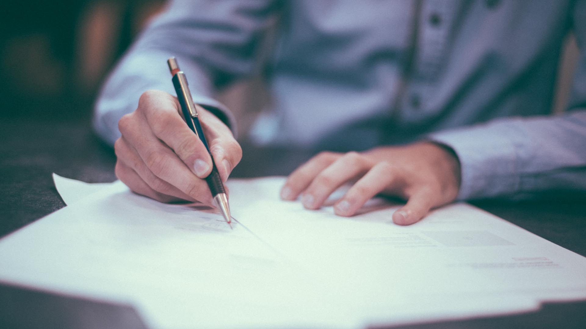 A foreigners filling a UAE visa application form
